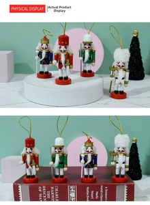Close-up of four 10cm hand-painted wooden nutcracker soldiers with golden hanging strings