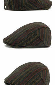 Detailed close-up of dark green wool blend flat cap with classic colorful herringbone pattern
