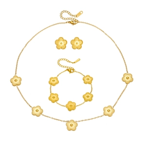Golden stainless steel jewelry set featuring clover necklaces, bracelets and earrings