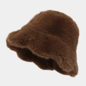Close-up of plush faux fur texture and ruffled brim on dark brown winter bucket hat