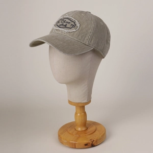 Khaki vintage washed cotton baseball cap with distressed letter embroidery in 45-degree view