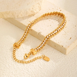 Detail of 18K gold plated bead chain bracelet with clear zircon inlay and lobster clasp
