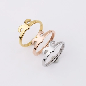 Three-color set of polished stainless steel rings with geometric hollow-out design