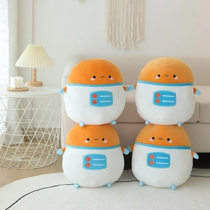 Set of four astronaut potato plush pillows with orange heads on a beige sofa