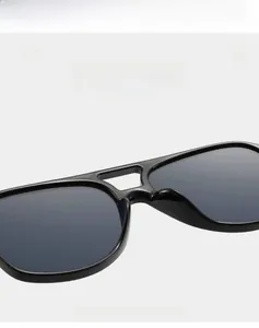 Detail of high-quality black aviator sunglasses with lightweight double-bridge design