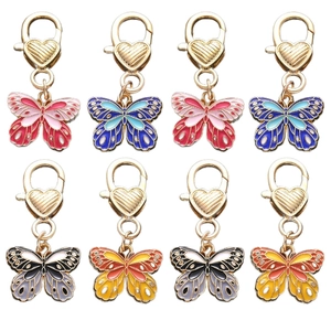 Set of 8 colorful butterfly keychains with heart-shaped gold lobster clasps and enamel finish