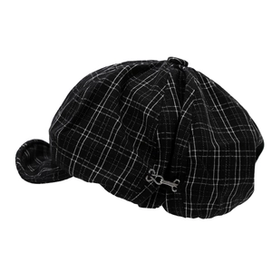 Classic black and white checkered newsboy cap with silver buckle detail on white background