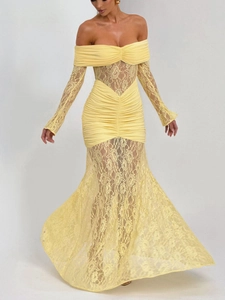 Detail of yellow off-the-shoulder lace patchwork and ruffled fishtail hemline fabric