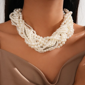 Close-up of elegant multi-layer faux pearl choker necklace with silver diamond accents