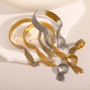 Detailed shot of 18K gold and silver plated stainless steel bead tassel jewelry set