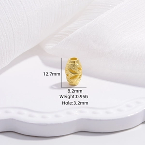 Macro view of gold hollow olive charm bead with dimensions 12.7x8.2mm and 3.2mm hole