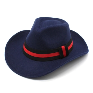 Detail of dark blue wool felt cowboy hat featuring a black and red striped ribbon band