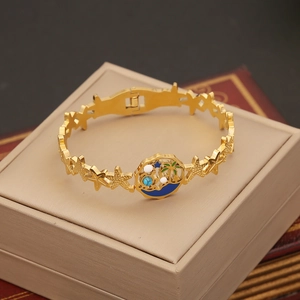 Golden stainless steel star bracelet with tropical palm tree and starfish enamel charms