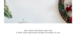Close-up of Christmas rattan wreath with green pine needles and red festive berries