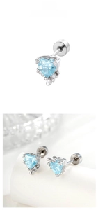 Close-up of heart-shaped light blue zircon earrings with secure screw back closure