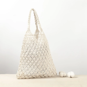 Close-up of handmade hollow cotton rope woven bag with inner lining and sturdy handles