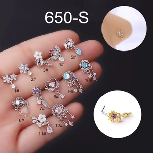 Detailed close-up of 12 assorted stainless steel L-shaped nose studs with zirconia