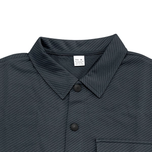 Detail view of heavy twill collar and fabric tag for men's slim fit shirt jacket