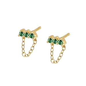 Detail view of gold drop earrings featuring three green zircons and a delicate chain dangle