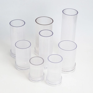 Vertical striped cylindrical candle molds in various sizes with stable base support