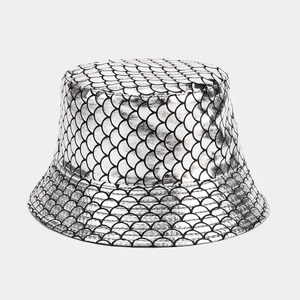 Detail of silver fish scale pattern on reversible bucket hat with metallic coating