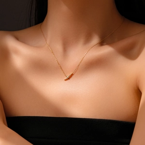 On-model view of a gold s925 silver necklace with micro-set cubic zirconia pendant