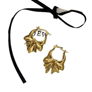 Chic 18K gold plated brass bow knot hoop earrings with heart detail on white backdrop
