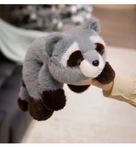 Close-up of soft grey raccoon plush toy showing fluffy texture and premium faux fur