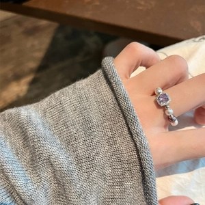 Elegant pearl beaded ring featuring a square purple zircon center stone with halo accents
