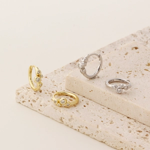 Detailed macro view of S925 sterling silver earrings with round cubic zirconia stones