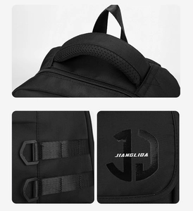 Detail view of reinforced handle, durable strap buckles, and embroidery on black backpack