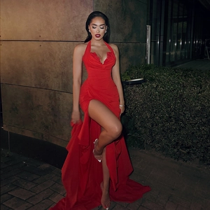 Elegant red backless halter maxi dress with high slit and lace trim for evening wear