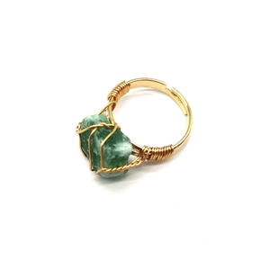 Handmade adjustable ring with gold wire wrap and green natural raw gemstone