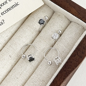 925 sterling silver ear cuffs with zircon stones and bead ends in a wooden box