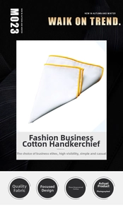 Close-up of white cotton pocket square with yellow rolled edges on a black fabric background