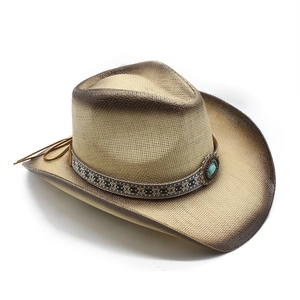 Detail of summer straw cowboy hat with turquoise stone band and burnt edge finish