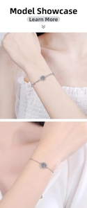 Close-up of S925 sterling silver bracelets featuring Moissanite round halo charm on wrist