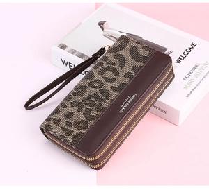 Detail of leopard print double zipper long wallet with a wristlet strap for women