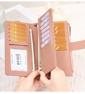 Pink RFID leather wallet interior showing multiple card slots and snap closure