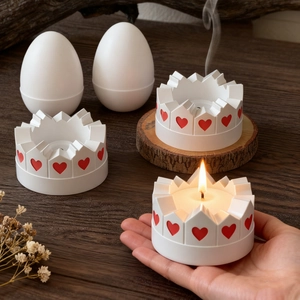 Detail of crown candle holder with red heart pattern on dark wood background