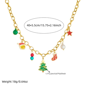 Golden Christmas necklace with charms of Santa, tree, bells and beads on white background
