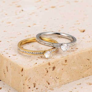Elegant six-prong stainless steel rings in gold and silver finish with sparkling zircons