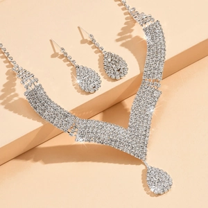 Elegant silver African bridal jewelry set with V-shaped rhinestone necklace and earrings