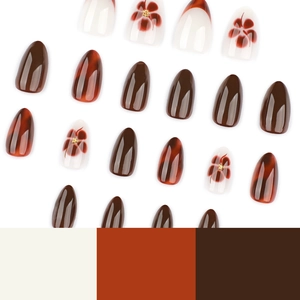 French almond press-on nails with amber texture and delicate floral patterns