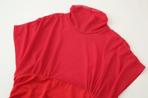 Detailed view of red high-neck mesh splicing top with elastic knit fabric texture