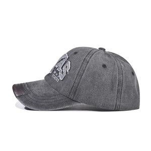 Close-up of vintage washed baseball cap with Texas embroidery and leather brim detail