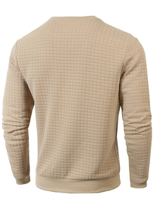 Detail view of khaki slim fit crewneck sweatshirt showing quilted grid texture and ribbed hem