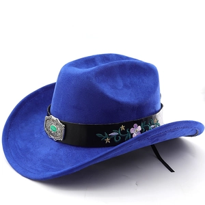 Detail of blue suede cowboy hat with turquoise buckle belt and floral embroidery