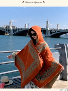 Bohemian ethnic hooded orange poncho shawl with heart patterns and tassels for travel photography