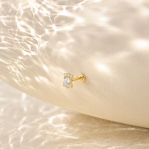 Detail of S925 sterling silver stamp on gold tassel earring with cubic zirconia